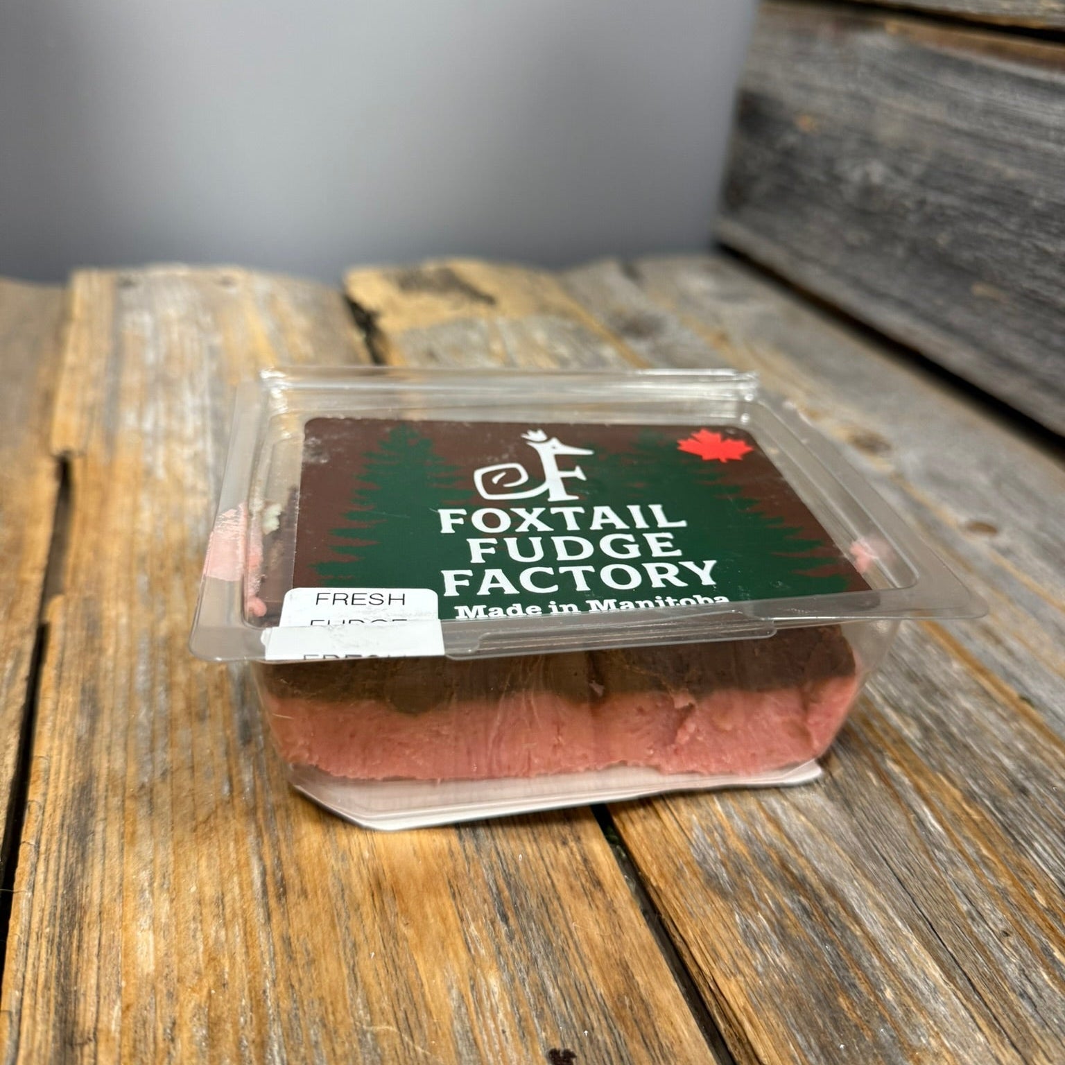 Packaged product from Foxtail Fudge Factory on a wooden surface
